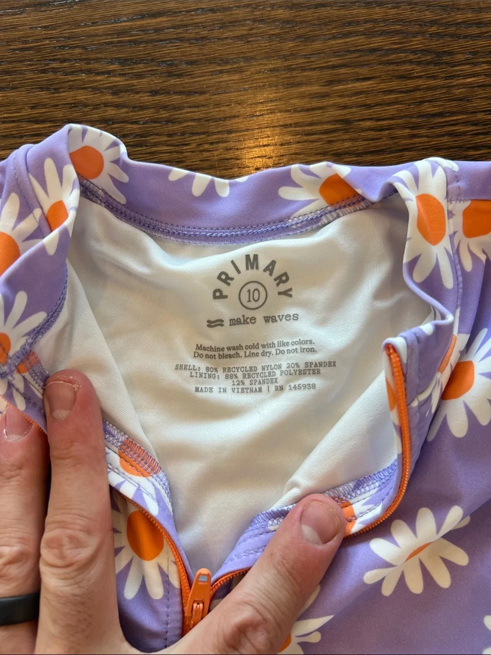 Primary Purple One-Piece Bathing Suit with White & Orange Daisy Print